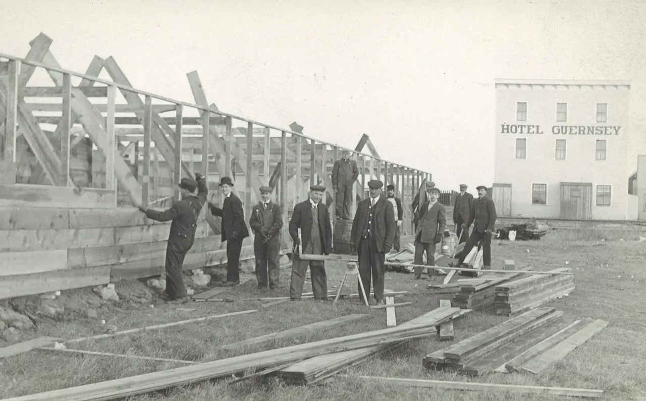 Men building a frame structure near Hotel Guernsey, about 1918